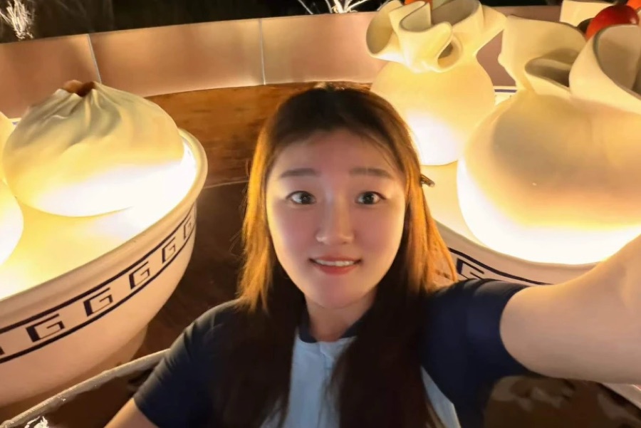 Selfie with giant lit-up dumpling sculptures